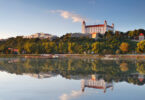 Bratislava castle with reflection in river Danube